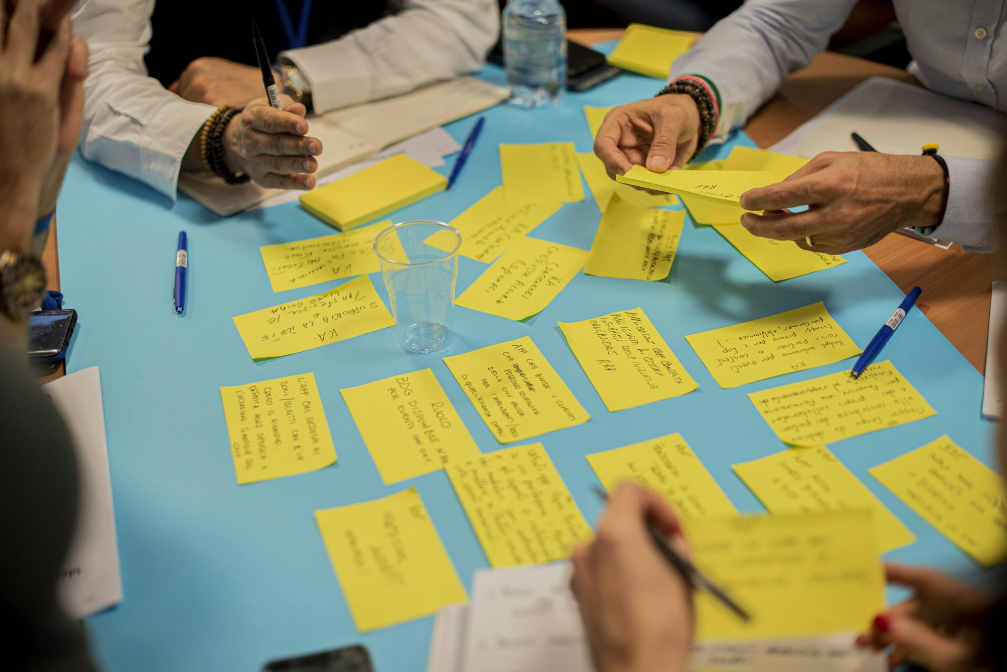 person-holding-yellow-sticky-notes.jpg person holding yellow sticky notes